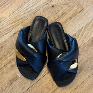 JW Anderson Black Leather Slide Mules with Gold Disc